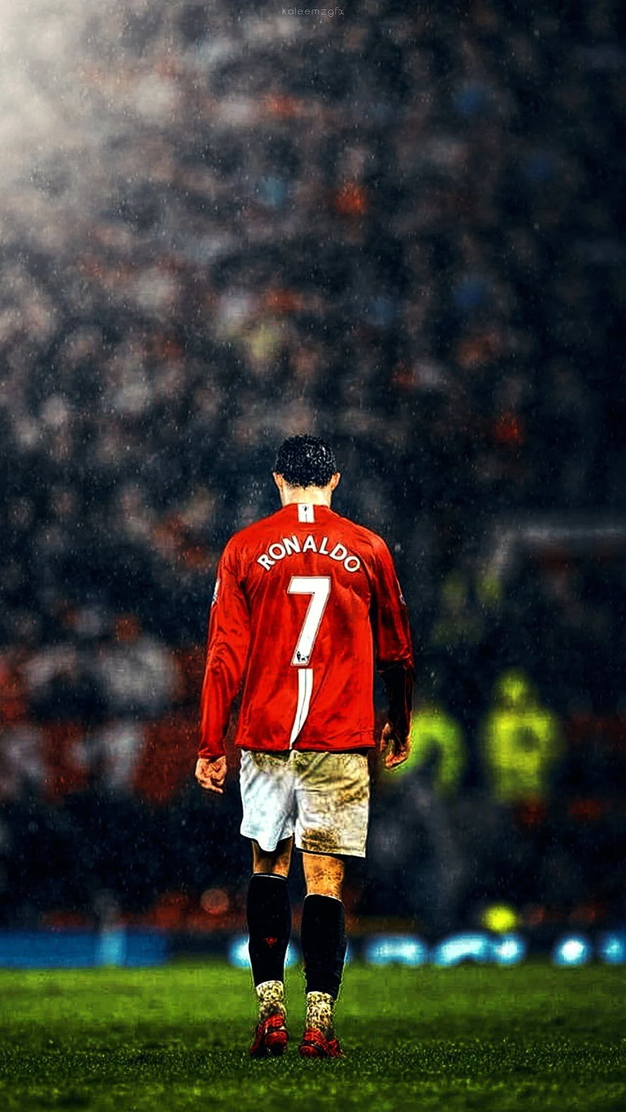 Cristiano Ronaldo Walking on the Pitch in Manchester United Kit Under Rain HD phone wallpaper
