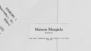 Maison Margiela Paris Minimalist Typography and Event Details on Textured Paper HD wallpaper