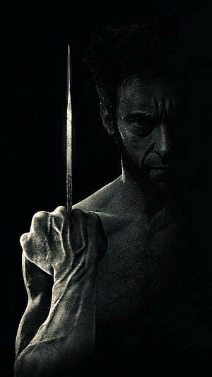Logan Wolverine Dark Portrait Holding Metal Claw in Dramatic Low-Key Lighting HD phone wallpaper