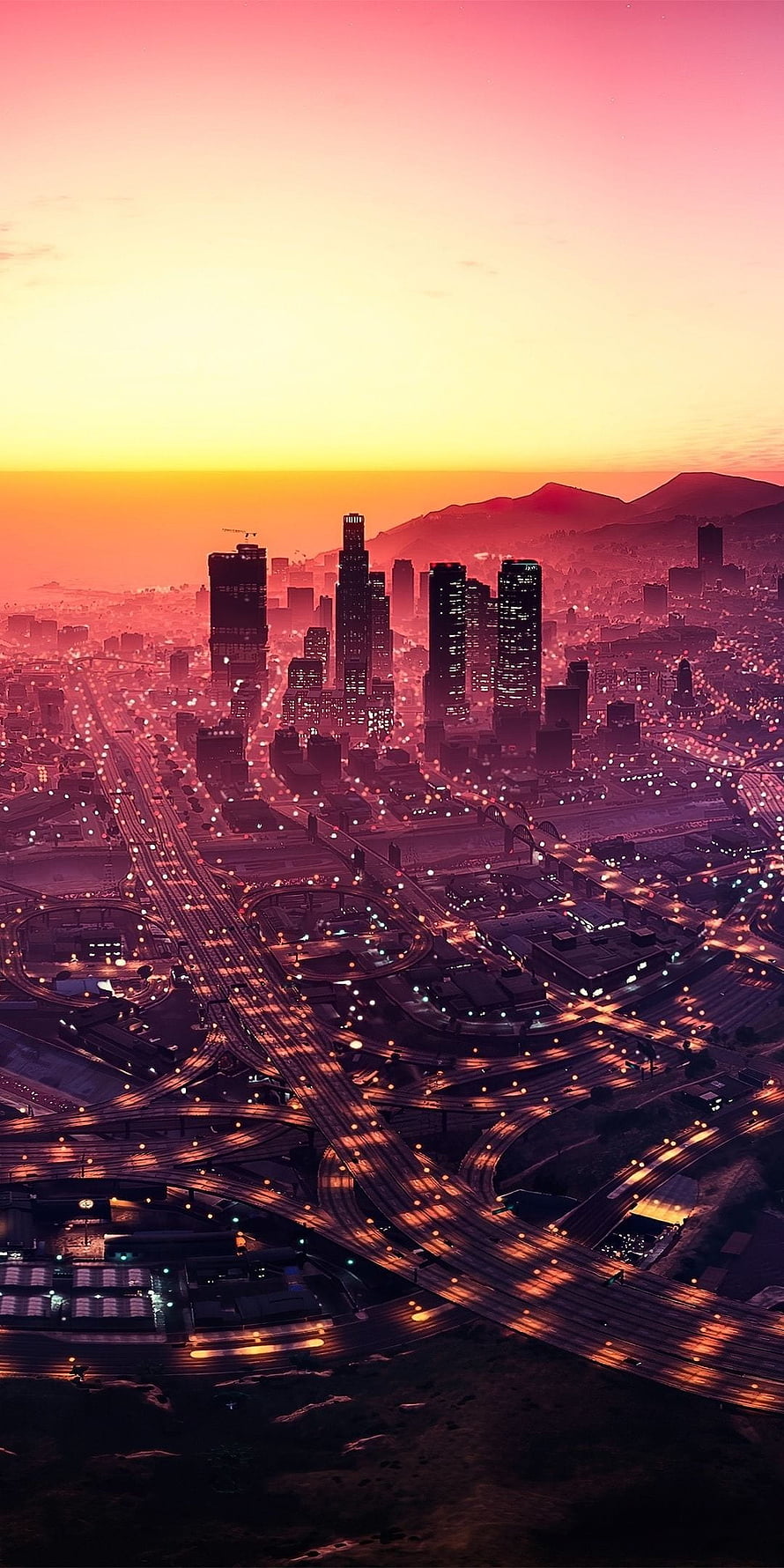 Los Santos Skyline at Dusk in GTA V with Glowing Highway Interchanges and Vibrant Sunset Sky HD phone wallpaper