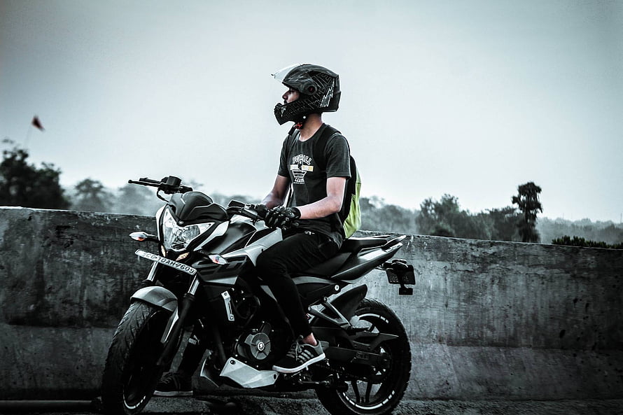 Rider on a Pulsar NS200 Motorcycle on a Concrete Overpass HD wallpaper