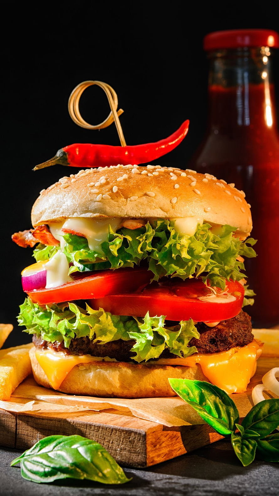 Gourmet Double Cheeseburger with Fresh Lettuce, Tomato, and Red Chili Pepper Garnish HD phone wallpaper