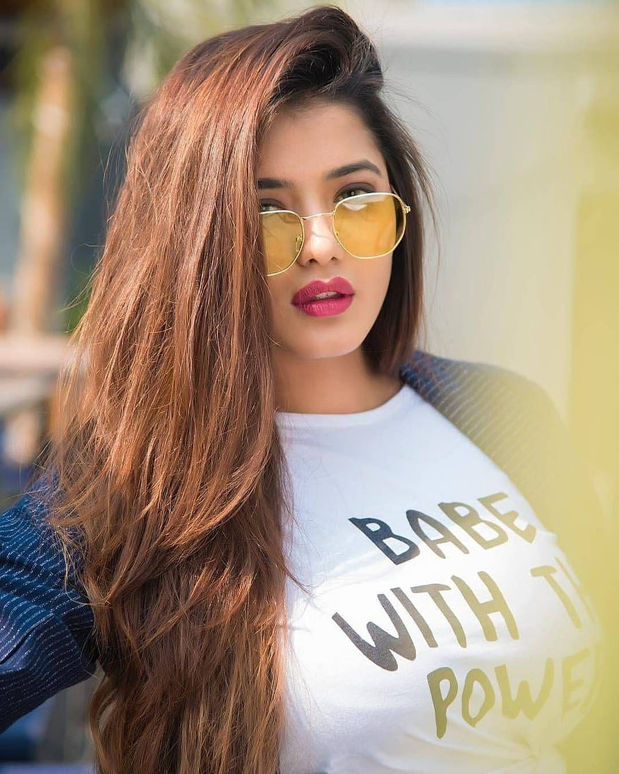 Ketika Sharma in yellow sunglasses and a white graphic t-shirt with long wavy hair HD phone wallpaper