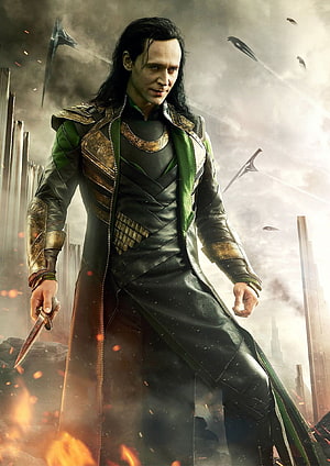 Loki Laufeyson in Green and Gold Armor Holding a Dagger Amidst a Battlefield of Fire and Smoke HD phone wallpaper