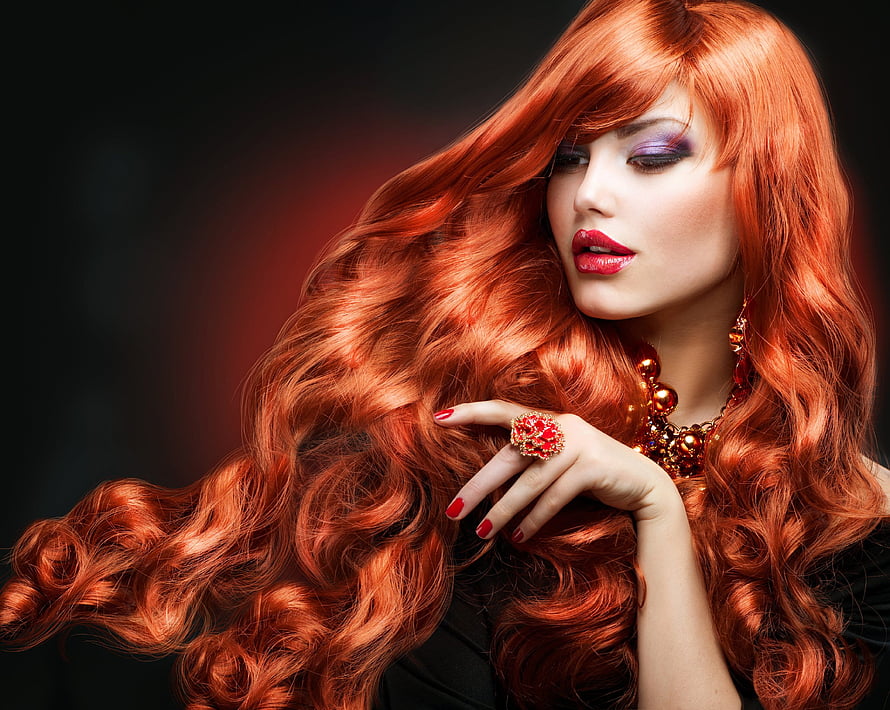 Glamorous Portrait of a Woman with Long Flowing Red Hair and Bold Makeup HD wallpaper