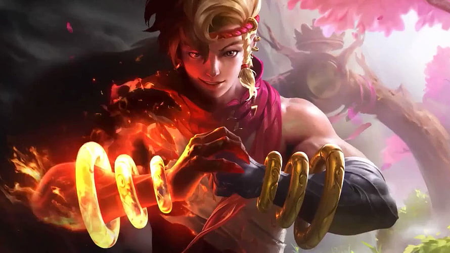 Yin from Mobile Legends: Bang Bang wielding fiery golden rings in a dramatic fantasy battle scene HD wallpaper