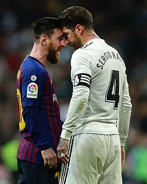 Lionel Messi and Sergio Ramos face off in a La Liga El Clasico match HD phone wallpaper