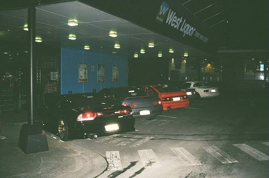 Classic JDM Drift Cars Parked at Night in Urban Street Setting HD wallpaper
