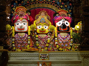 Jagannath Temple Deities in Ornate Attire with Marigold Garlands and Traditional Headdresses HD wallpaper