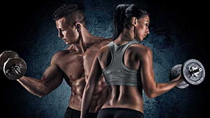 Muscular Man And Woman Lifting Dumbbells In Dark Gym Setting HD wallpaper
