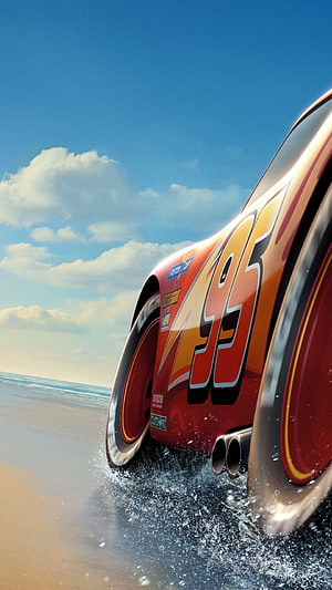 Lightning McQueen from Cars 3 Racing Along the Beach with Water Splashes HD phone wallpaper