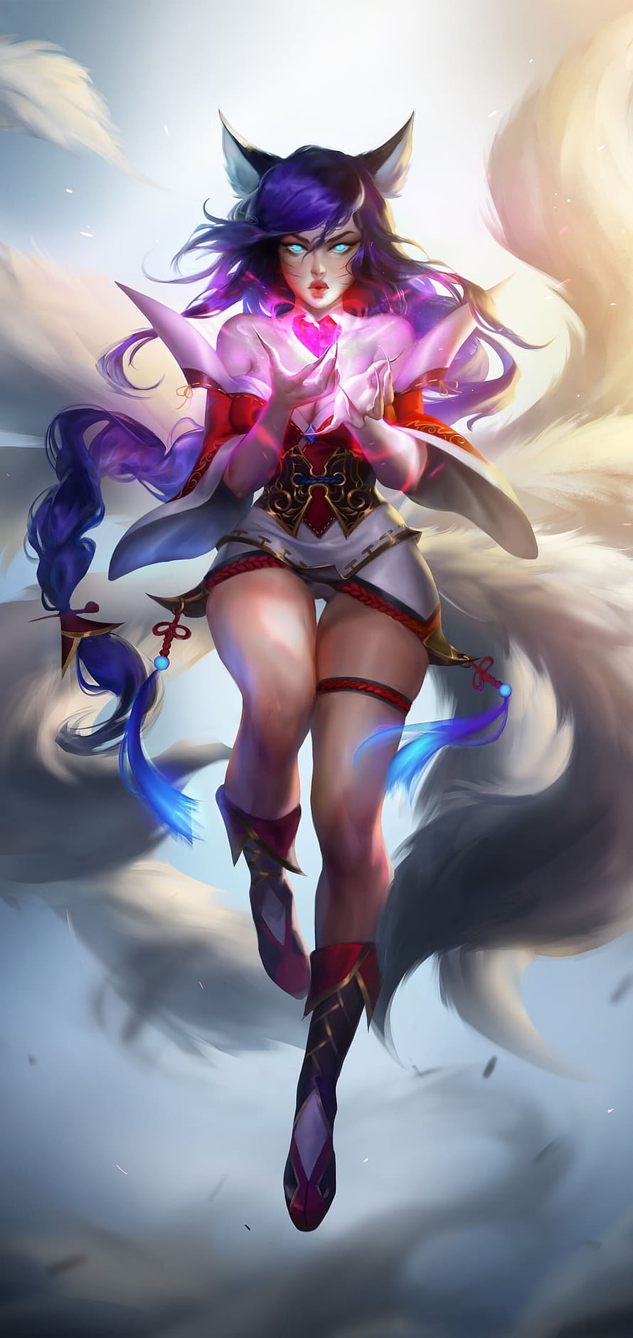 Ahri from League of Legends with glowing fox ears and magical energy HD phone wallpaper