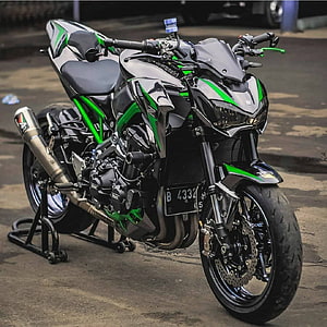 Kawasaki Ninja Z900 Sportbike in Black and Green Parked on Concrete HD phone wallpaper
