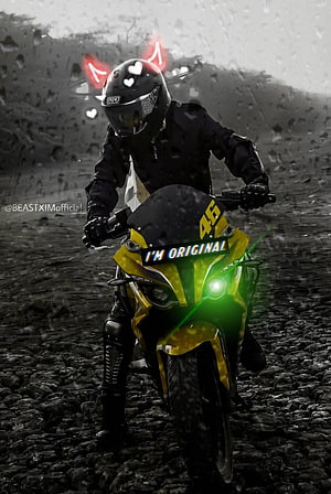 Rider on a Yellow Pulsar RS200 Motorcycle on a Gravel Road with Green Headlight Glow HD phone wallpaper