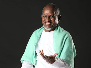 Ilayaraja Portrait in White Kurta and Mint Green Shawl Against Dark Background HD wallpaper