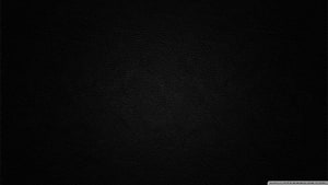 Dark Textured Black Leather Surface with Subtle Grain Pattern HD wallpaper