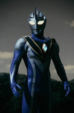 Ultraman Agul Standing Heroic Portrait in Dark Blue and Silver Suit HD phone wallpaper