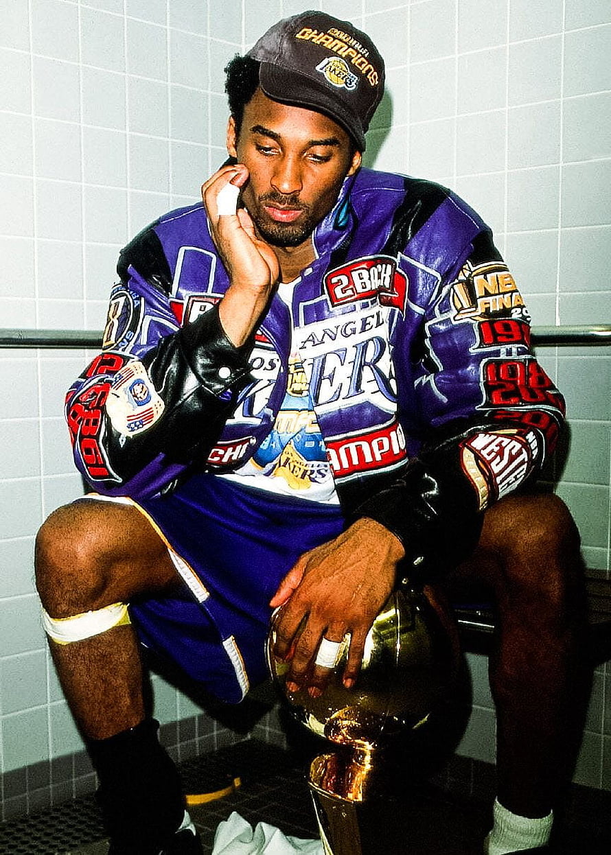 Kobe Bryant in Lakers Championship Jacket Holding Trophy in Locker Room HD phone wallpaper