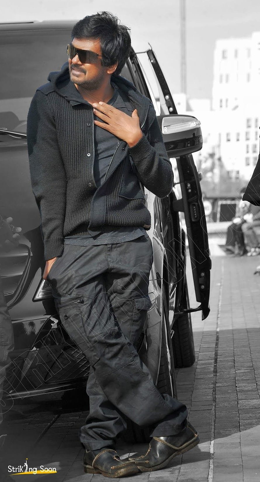 Puri Jagannadh in Black Knit Cardigan and Cargo Pants Leaning Against SUV HD phone wallpaper