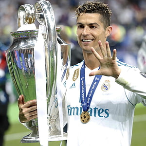 Cristiano Ronaldo Celebrates Champions League Victory with Real Madrid Trophy HD phone wallpaper