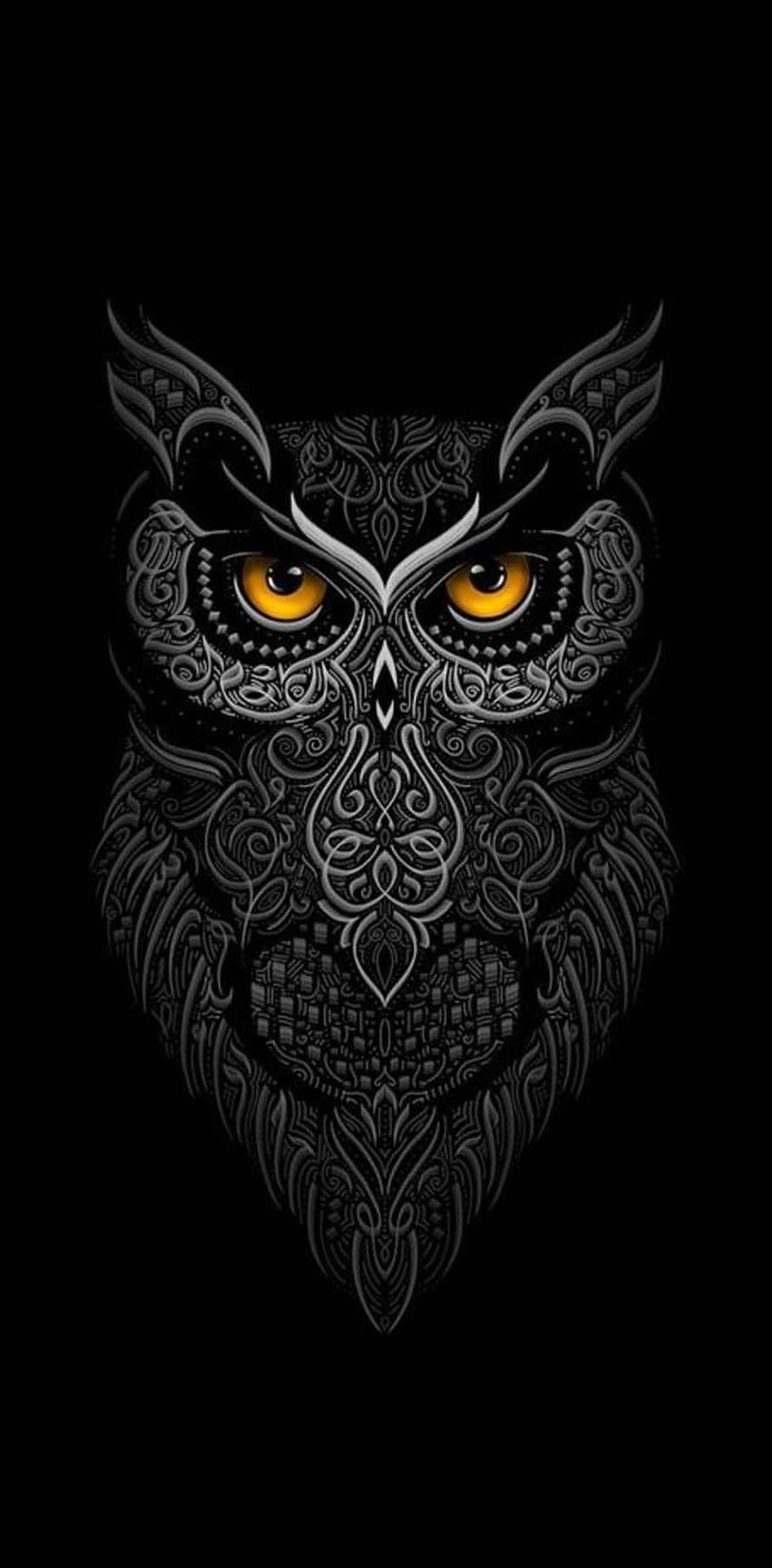 Intricate Ornamental Owl Face with Glowing Amber Eyes on Black Background HD phone wallpaper