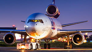 FedEx McDonnell Douglas MD-11 Pushback at Dusk on Airport Tarmac HD wallpaper
