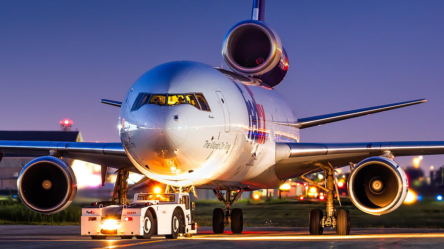 FedEx McDonnell Douglas MD-11 Pushback at Dusk on Airport Tarmac HD wallpaper