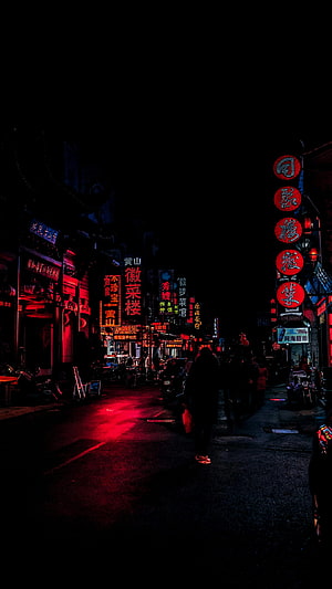 Neon-lit Chinese street at night with glowing red signs and pedestrians HD phone wallpaper