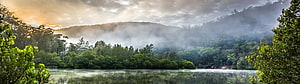 Misty Mountain Lake at Sunrise with Lush Forest Reflections HD wallpaper
