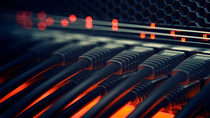 Close-up of network switch ports with glowing red indicator lights and ethernet cables in a data center HD wallpaper