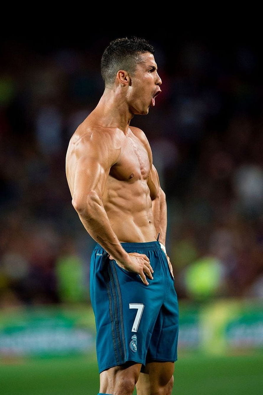 Cristiano Ronaldo shirtless on the pitch wearing Real Madrid shorts HD phone wallpaper