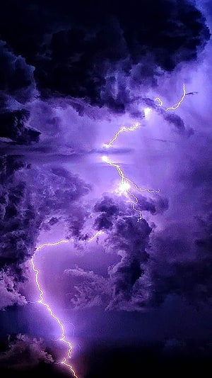 Vivid Purple Lightning Storm Illuminating Dark Clouds at Night HD phone wallpaper