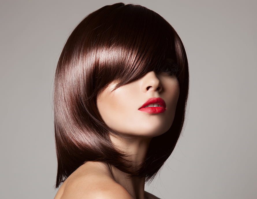 Elegant Woman with Sleek Brown Bob Haircut and Bold Red Lip Makeup Portrait HD wallpaper