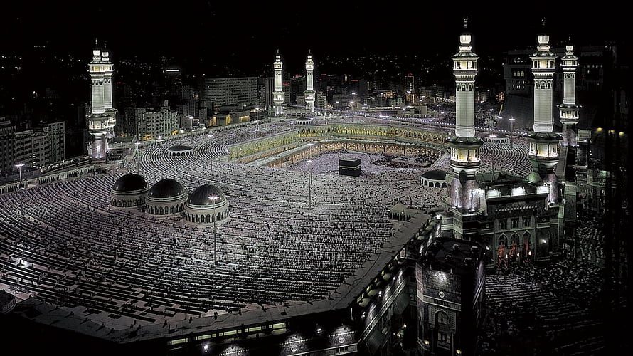 Aerial Night View of the Grand Mosque in Mecca with the Kaaba and Minarets HD wallpaper
