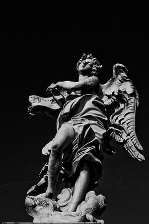 Dramatic Black and White Photograph of a Baroque Angel Statue with Spread Wings HD phone wallpaper