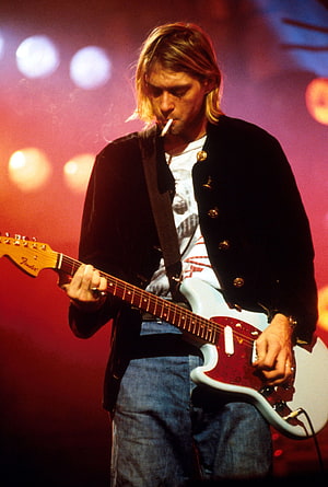 Kurt Cobain performing live on stage with a Fender Stratocaster guitar HD phone wallpaper