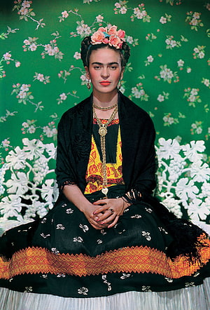 Frida Kahlo Portrait in Traditional Mexican Dress with Floral Crown and Green Backdrop HD phone wallpaper