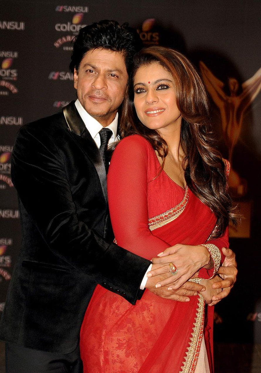 Shah Rukh Khan and Kajol at a red carpet event in formal and traditional attire HD phone wallpaper