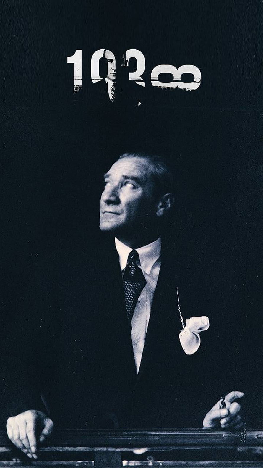 Mustafa Kemal Ataturk in a formal suit with a pocket watch chain, looking upward in a dramatic black and white portrait HD phone wallpaper