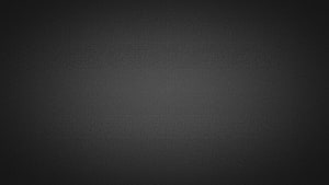 Minimalist Dark Gray Gradient Texture with Subtle Vignette and Soft Center Glow HD wallpaper