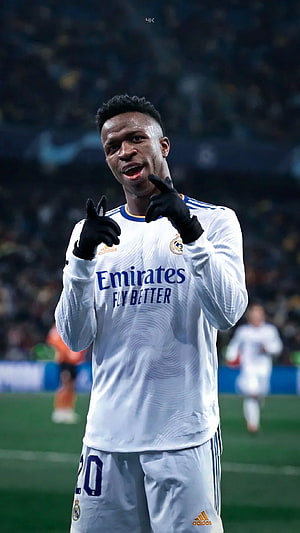 Vinicius Jr in Real Madrid Home Kit Pointing at Camera on the Pitch HD phone wallpaper