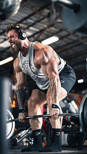 Gymshark Athlete Performing Intense Barbell Deadlift in Industrial Gym Setting HD phone wallpaper