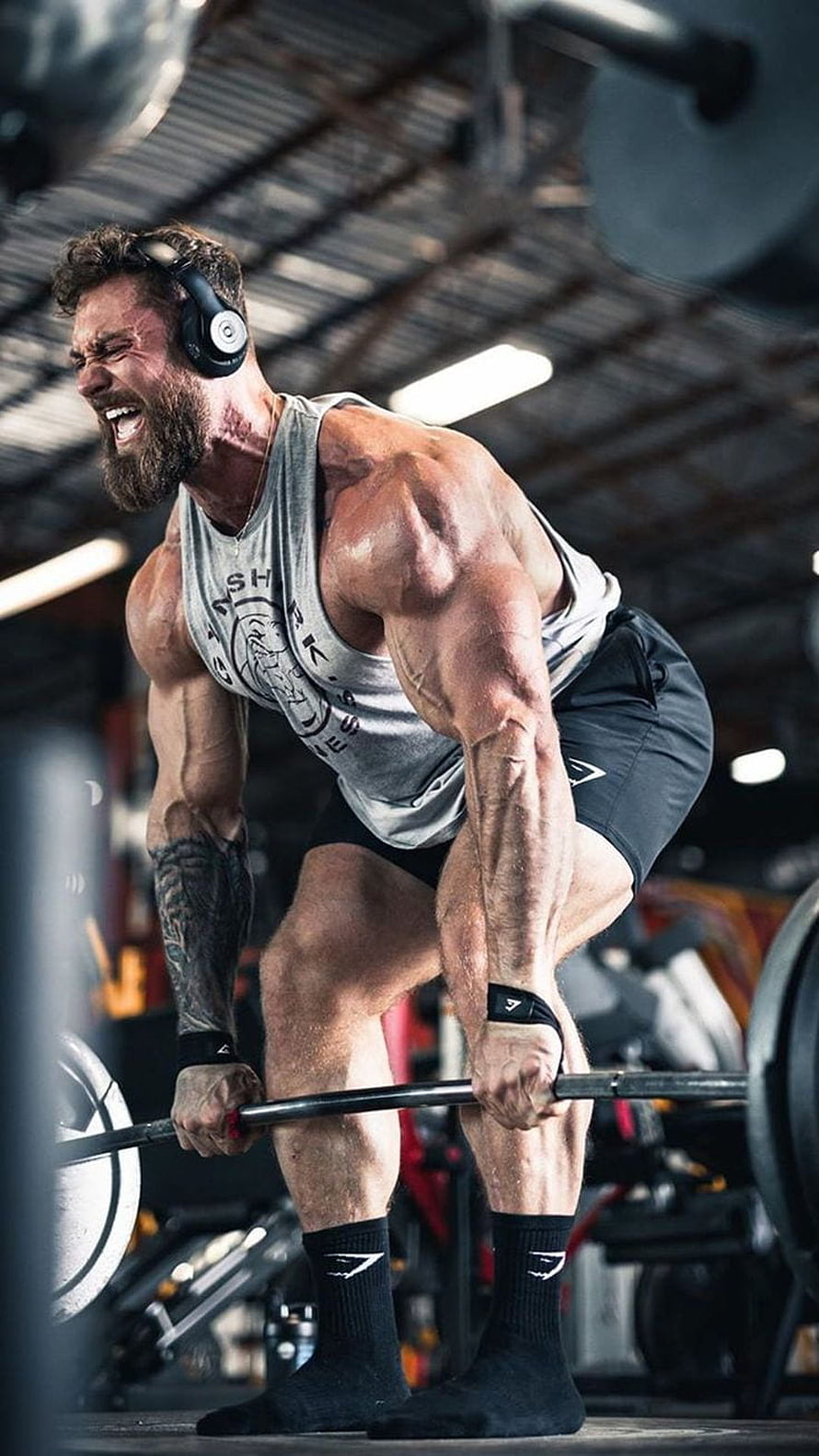 Gymshark Athlete Performing Intense Barbell Deadlift in Industrial Gym Setting HD phone wallpaper