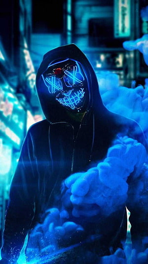 Hacker Joker in a dark hoodie with a glowing neon blue mask and red eyes surrounded by smoke HD phone wallpaper