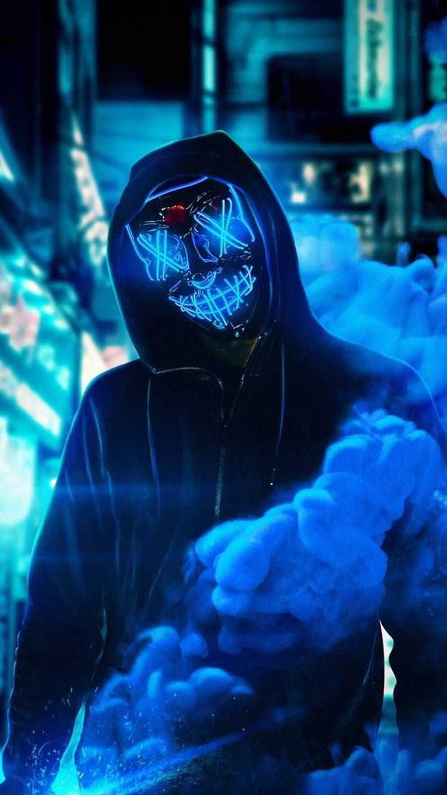 Hacker Joker in a dark hoodie with a glowing neon blue mask and red eyes surrounded by smoke HD phone wallpaper