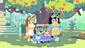 Bluey and Bingo Playing in a Wagon with Bandit and Chilli in the Garden HD wallpaper