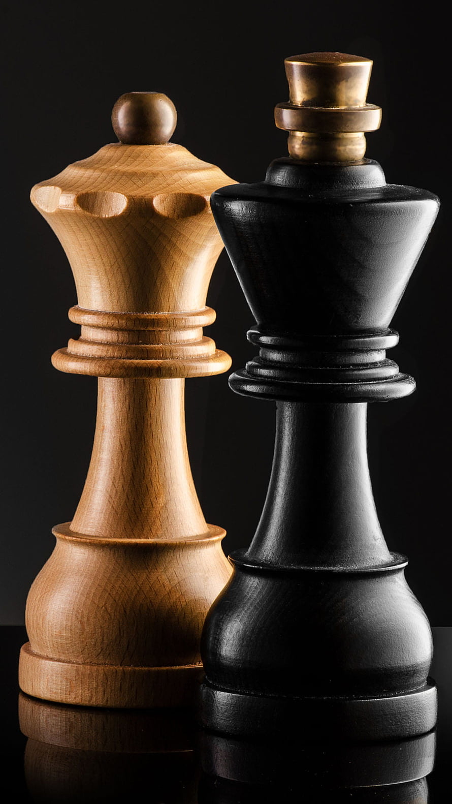 Elegant Wooden Chess King and Queen Pieces on Black Background HD phone wallpaper