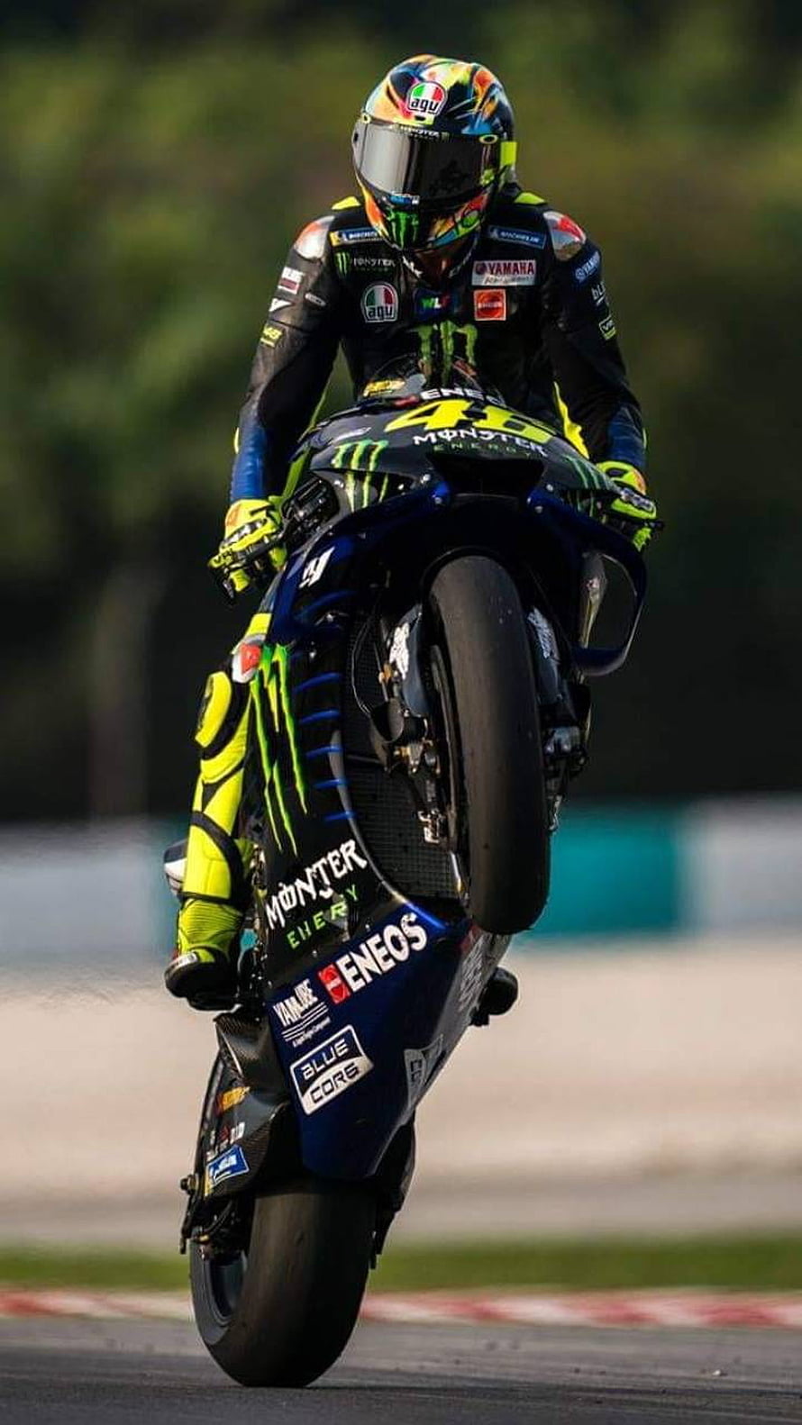 Valentino Rossi on Yamaha YZR-M1 MotoGP Bike with Monster Energy Livery HD phone wallpaper