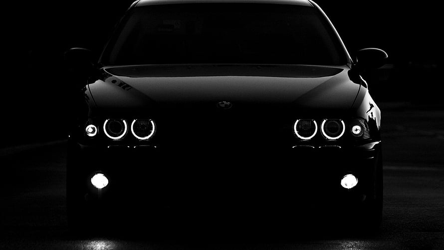 Black BMW M3 Front View with Angel Eyes Headlights in Dark Setting HD wallpaper