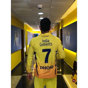MS Dhoni in India Yellow Jersey Walking Through Stadium Tunnel HD phone wallpaper